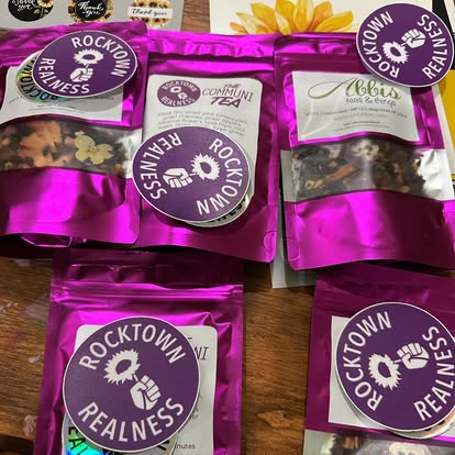 Local tea packets topped with purple Rocktown Realness stickers
